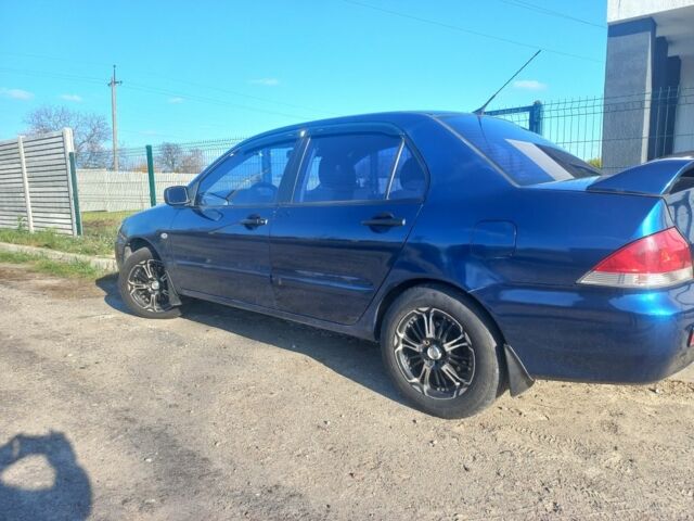 Синій Міцубісі Lancer, об'ємом двигуна 1 л та пробігом 111 тис. км за 3100 $, фото 1 на Automoto.ua