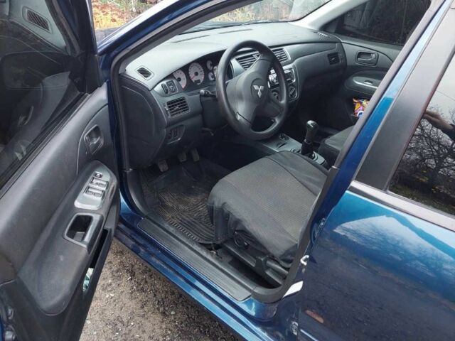 Синий Мицубиси Лансер, объемом двигателя 1.6 л и пробегом 87 тыс. км за 7000 $, фото 9 на Automoto.ua