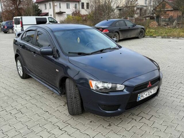 Синій Міцубісі Lancer, об'ємом двигуна 2 л та пробігом 324 тис. км за 5999 $, фото 3 на Automoto.ua