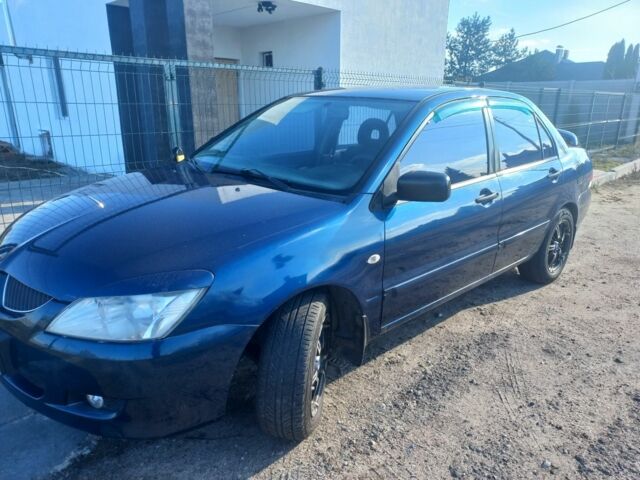 Синій Міцубісі Lancer, об'ємом двигуна 1 л та пробігом 111 тис. км за 3100 $, фото 4 на Automoto.ua