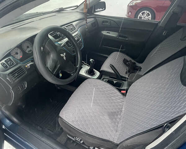 Синий Мицубиси Лансер, объемом двигателя 1.58 л и пробегом 319 тыс. км за 3700 $, фото 8 на Automoto.ua