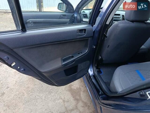 Синий Мицубиси Лансер, объемом двигателя 1.5 л и пробегом 211 тыс. км за 5222 $, фото 21 на Automoto.ua