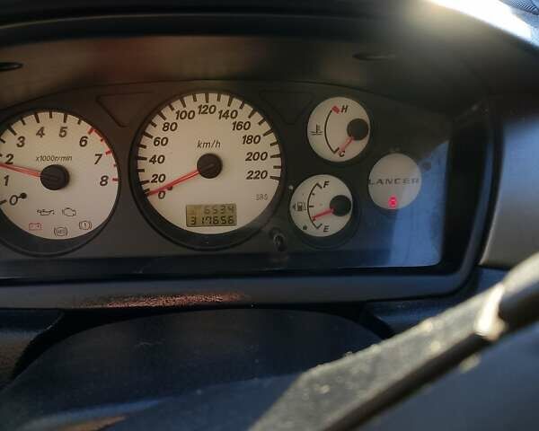 Синій Міцубісі Lancer, об'ємом двигуна 1.58 л та пробігом 317 тис. км за 3600 $, фото 2 на Automoto.ua