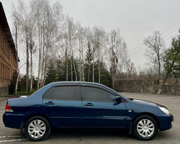 Синий Мицубиси Лансер, объемом двигателя 1.6 л и пробегом 185 тыс. км за 4950 $, фото 13 на Automoto.ua