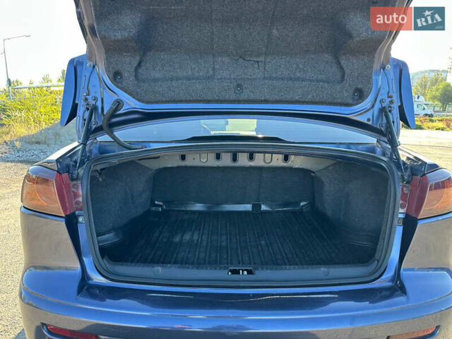 Синій Міцубісі Lancer, об'ємом двигуна 2 л та пробігом 240 тис. км за 6800 $, фото 8 на Automoto.ua