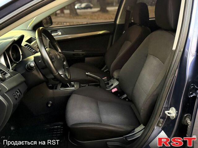 Синий Мицубиси Лансер, объемом двигателя 2 л и пробегом 189 тыс. км за 7350 $, фото 2 на Automoto.ua