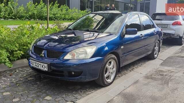 Синій Міцубісі Lancer, об'ємом двигуна 1.6 л та пробігом 198 тис. км за 4800 $, фото 4 на Automoto.ua