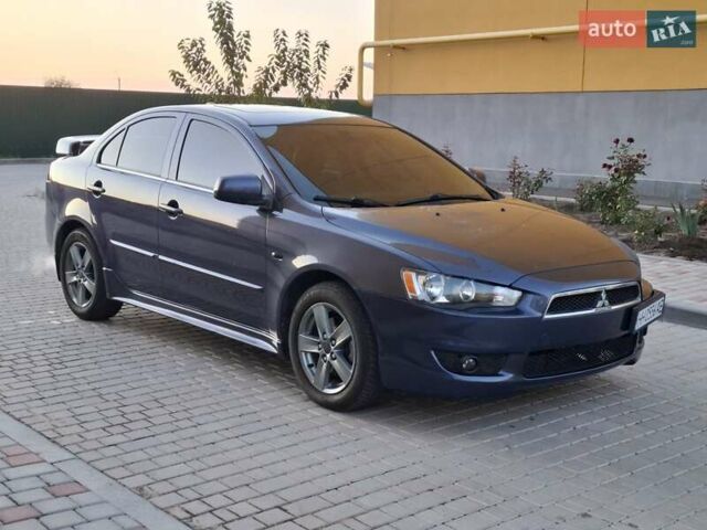 Синій Міцубісі Lancer, об'ємом двигуна 2 л та пробігом 234 тис. км за 6700 $, фото 9 на Automoto.ua
