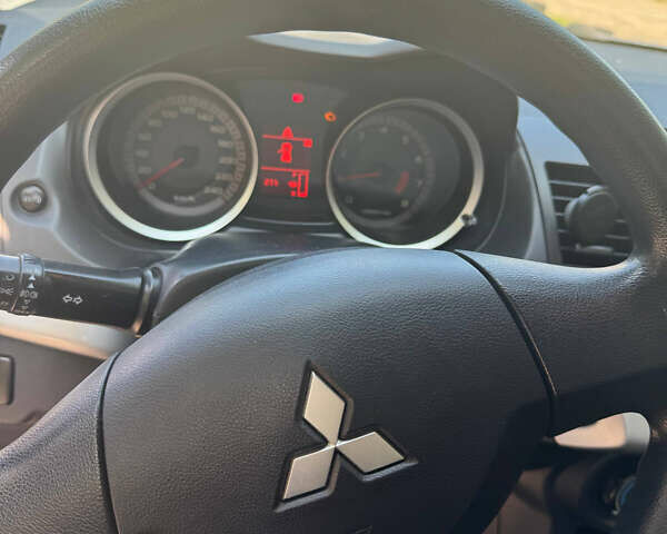 Синий Мицубиси Лансер, объемом двигателя 1.47 л и пробегом 250 тыс. км за 4500 $, фото 10 на Automoto.ua