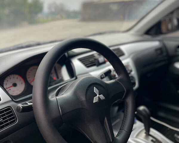 Синий Мицубиси Лансер, объемом двигателя 1.6 л и пробегом 185 тыс. км за 4950 $, фото 19 на Automoto.ua