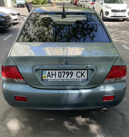 Синій Міцубісі Lancer, об'ємом двигуна 1.58 л та пробігом 210 тис. км за 5300 $, фото 5 на Automoto.ua