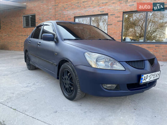Синий Мицубиси Лансер, объемом двигателя 2 л и пробегом 100 тыс. км за 4999 $, фото 2 на Automoto.ua