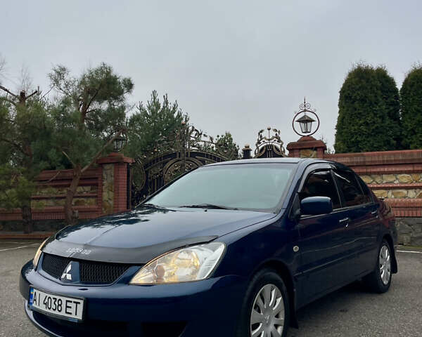 Синий Мицубиси Лансер, объемом двигателя 1.6 л и пробегом 185 тыс. км за 4950 $, фото 3 на Automoto.ua
