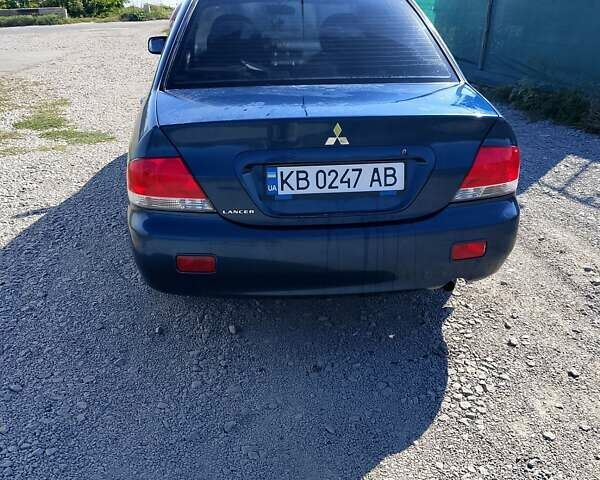 Синій Міцубісі Lancer, об'ємом двигуна 1.58 л та пробігом 317 тис. км за 3600 $, фото 6 на Automoto.ua