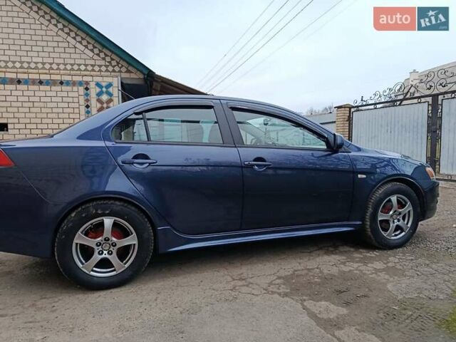 Синий Мицубиси Лансер, объемом двигателя 1.5 л и пробегом 211 тыс. км за 5222 $, фото 5 на Automoto.ua