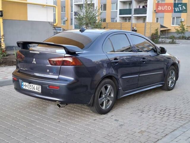 Синій Міцубісі Lancer, об'ємом двигуна 2 л та пробігом 234 тис. км за 6700 $, фото 5 на Automoto.ua
