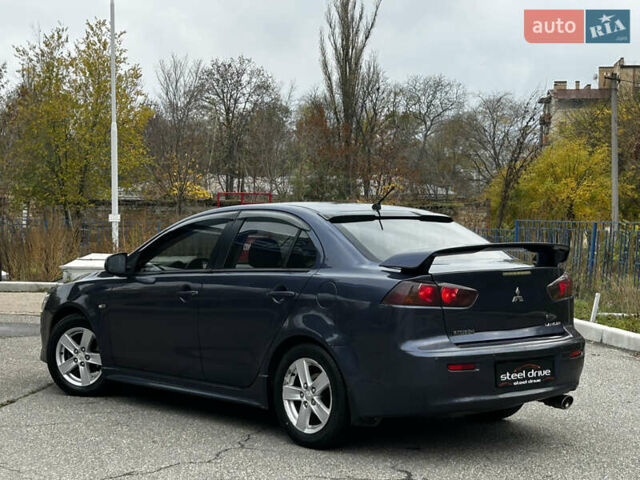 Синій Міцубісі Lancer, об'ємом двигуна 2 л та пробігом 222 тис. км за 5999 $, фото 4 на Automoto.ua