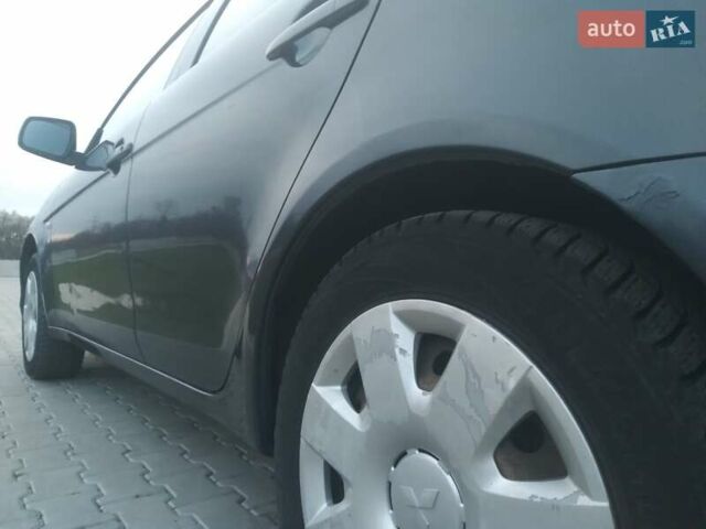 Синий Мицубиси Лансер, объемом двигателя 1.5 л и пробегом 260 тыс. км за 5000 $, фото 24 на Automoto.ua