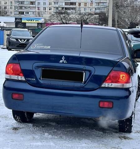 Синій Міцубісі Lancer, об'ємом двигуна 1.58 л та пробігом 233 тис. км за 4150 $, фото 2 на Automoto.ua
