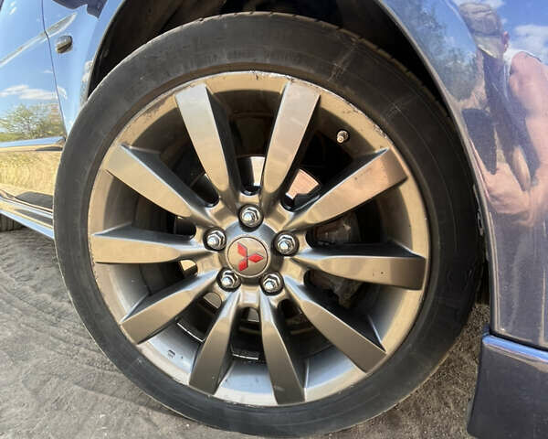 Синій Міцубісі Lancer, об'ємом двигуна 2 л та пробігом 185 тис. км за 7700 $, фото 9 на Automoto.ua