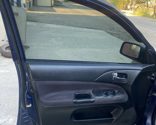 Синий Мицубиси Лансер, объемом двигателя 2 л и пробегом 100 тыс. км за 4999 $, фото 12 на Automoto.ua