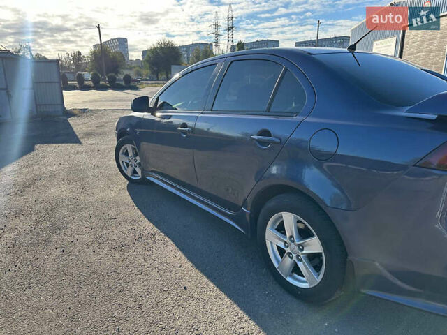 Синій Міцубісі Lancer, об'ємом двигуна 2 л та пробігом 240 тис. км за 6800 $, фото 3 на Automoto.ua