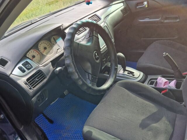 Синий Мицубиси Лансер, объемом двигателя 2 л и пробегом 260 тыс. км за 4200 $, фото 1 на Automoto.ua