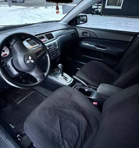 Синій Міцубісі Lancer, об'ємом двигуна 1.58 л та пробігом 233 тис. км за 4150 $, фото 5 на Automoto.ua
