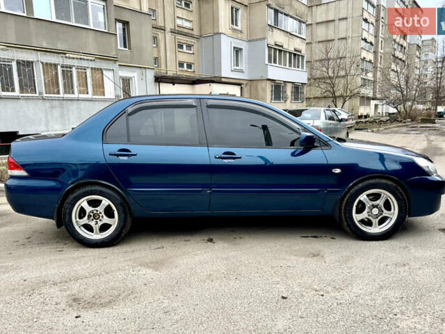 Синий Мицубиси Лансер, объемом двигателя 1.6 л и пробегом 200 тыс. км за 4499 $, фото 6 на Automoto.ua