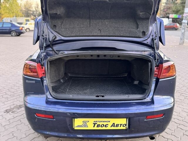 Синій Міцубісі Lancer, об'ємом двигуна 2 л та пробігом 189 тис. км за 7350 $, фото 14 на Automoto.ua