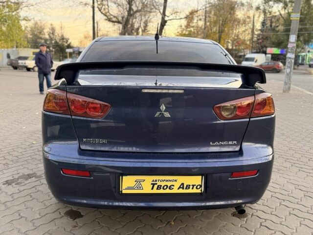 Синій Міцубісі Lancer, об'ємом двигуна 2 л та пробігом 189 тис. км за 7350 $, фото 4 на Automoto.ua
