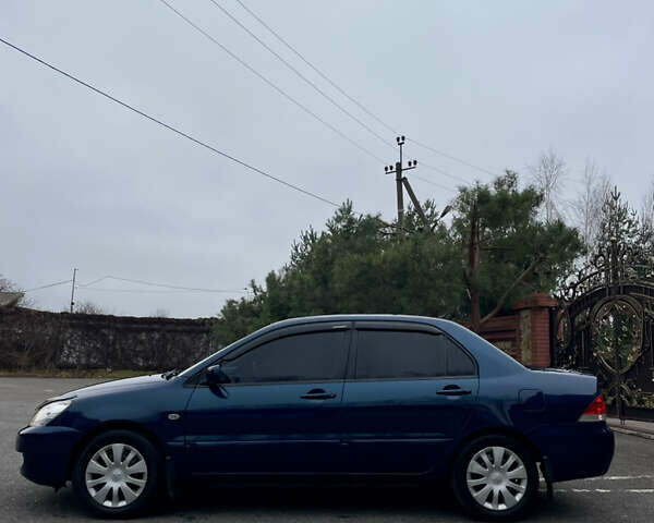 Синий Мицубиси Лансер, объемом двигателя 1.6 л и пробегом 185 тыс. км за 4950 $, фото 12 на Automoto.ua