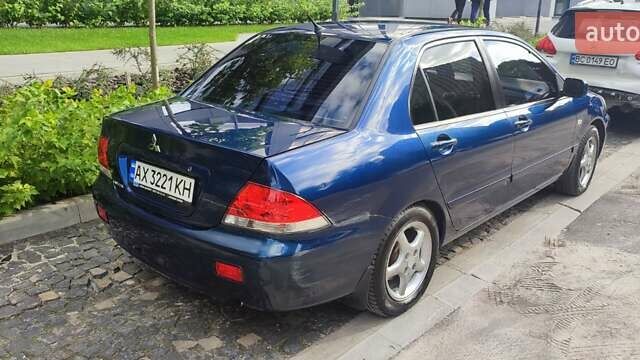 Синій Міцубісі Lancer, об'ємом двигуна 1.6 л та пробігом 198 тис. км за 4800 $, фото 1 на Automoto.ua