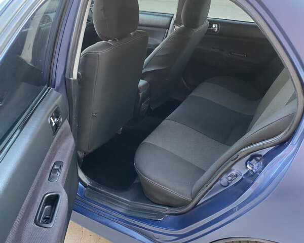 Синий Мицубиси Лансер, объемом двигателя 2 л и пробегом 100 тыс. км за 4999 $, фото 14 на Automoto.ua