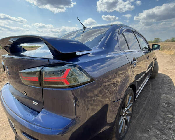Синій Міцубісі Lancer, об'ємом двигуна 2 л та пробігом 185 тис. км за 7700 $, фото 5 на Automoto.ua