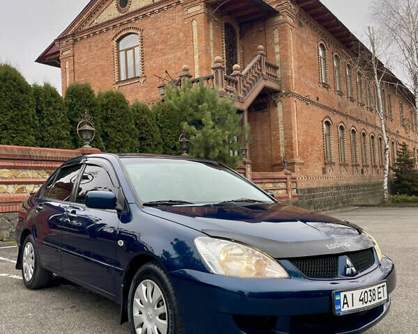 Синий Мицубиси Лансер, объемом двигателя 1.6 л и пробегом 185 тыс. км за 4950 $, фото 2 на Automoto.ua