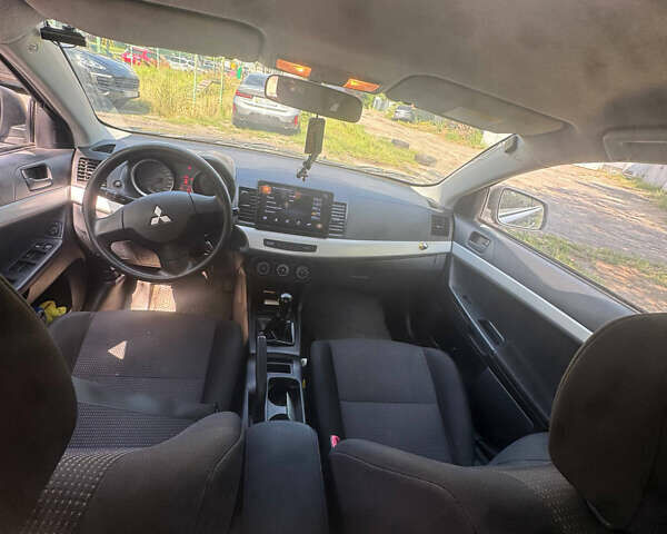 Синий Мицубиси Лансер, объемом двигателя 1.47 л и пробегом 250 тыс. км за 4500 $, фото 11 на Automoto.ua