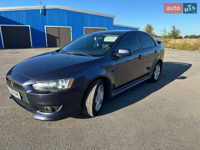 Синій Міцубісі Lancer, об'ємом двигуна 2 л та пробігом 240 тис. км за 6800 $, фото 5 на Automoto.ua