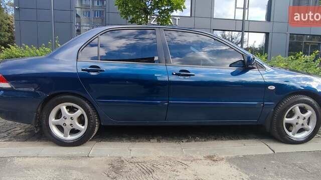 Синій Міцубісі Lancer, об'ємом двигуна 1.6 л та пробігом 198 тис. км за 4800 $, фото 2 на Automoto.ua