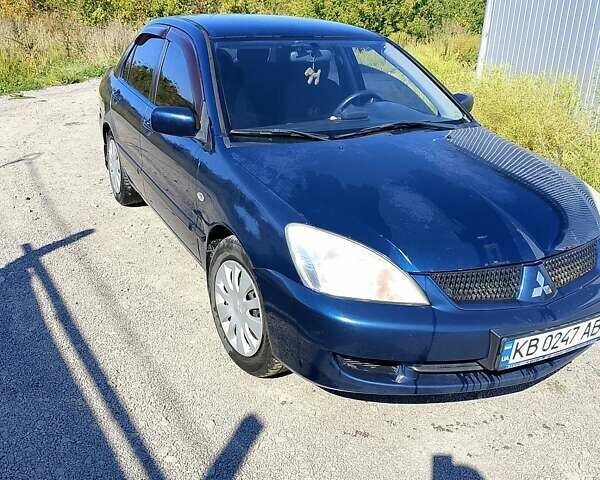 Синій Міцубісі Lancer, об'ємом двигуна 1.58 л та пробігом 317 тис. км за 3600 $, фото 7 на Automoto.ua