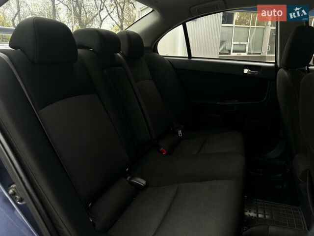 Синій Міцубісі Lancer, об'ємом двигуна 2 л та пробігом 222 тис. км за 5999 $, фото 13 на Automoto.ua