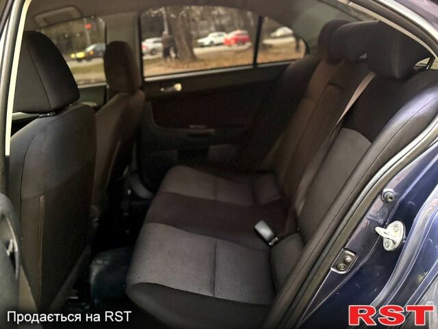 Синий Мицубиси Лансер, объемом двигателя 2 л и пробегом 189 тыс. км за 7350 $, фото 3 на Automoto.ua