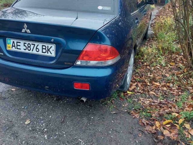 Синий Мицубиси Лансер, объемом двигателя 1.6 л и пробегом 87 тыс. км за 7000 $, фото 1 на Automoto.ua