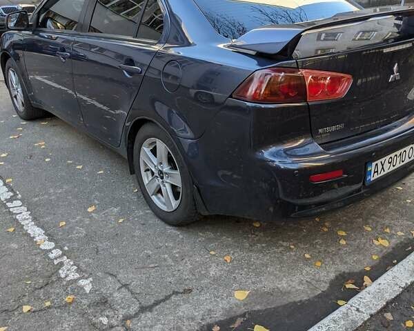Синий Мицубиси Лансер, объемом двигателя 2 л и пробегом 300 тыс. км за 6250 $, фото 4 на Automoto.ua