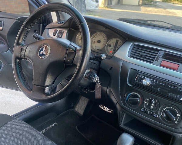 Синий Мицубиси Лансер, объемом двигателя 2 л и пробегом 100 тыс. км за 4999 $, фото 9 на Automoto.ua