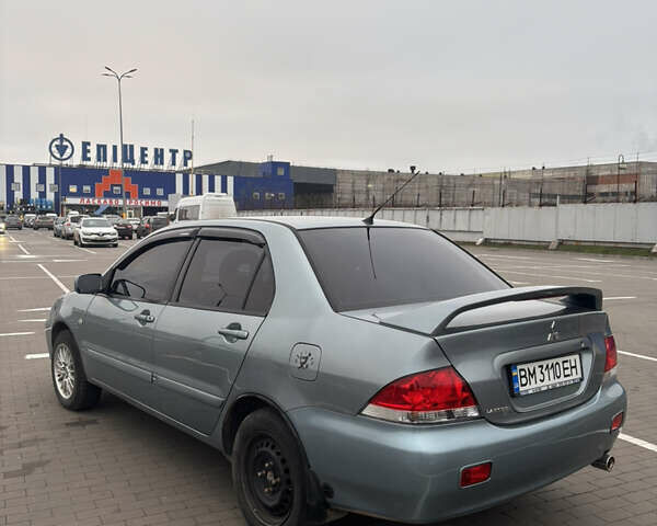 Синий Мицубиси Лансер, объемом двигателя 1.6 л и пробегом 238 тыс. км за 3500 $, фото 5 на Automoto.ua