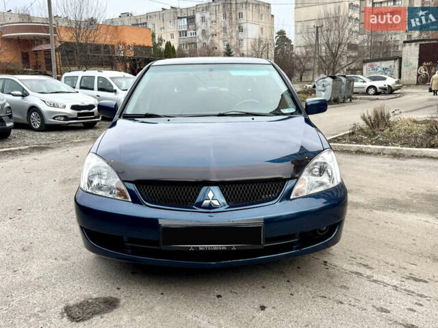 Синий Мицубиси Лансер, объемом двигателя 1.6 л и пробегом 200 тыс. км за 4499 $, фото 1 на Automoto.ua