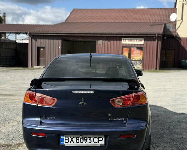 Синий Мицубиси Лансер, объемом двигателя 1.5 л и пробегом 150 тыс. км за 6599 $, фото 2 на Automoto.ua