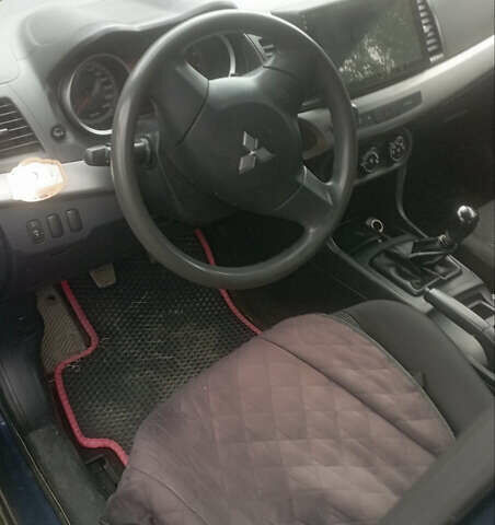 Синий Мицубиси Лансер, объемом двигателя 1.47 л и пробегом 172 тыс. км за 6350 $, фото 4 на Automoto.ua