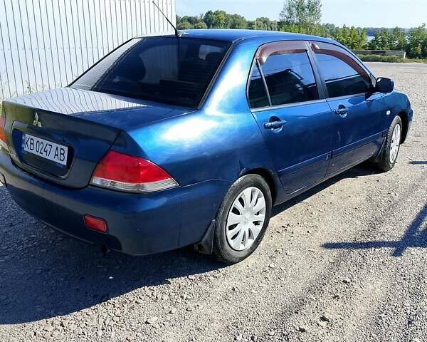 Синій Міцубісі Lancer, об'ємом двигуна 1.58 л та пробігом 317 тис. км за 3600 $, фото 5 на Automoto.ua